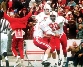  ?? (AP/Lincoln Journal Star file photo) ?? Nebraska’s Johnny Rodgers (20) celebrates in the end zone after his 72-yard punt return for a touchdown that helped the top-ranked Cornhusker­s beat No. 2 Oklahoma 35-31 on Nov. 25, 1971, in Norman, Okla. Nebraska and Oklahoma will meet today for the first time since 2010.