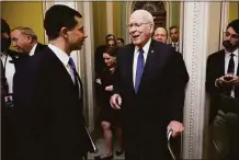  ?? Getty Images ?? U.S. Transporta­tion Secretary Pete Buttigieg, left, talks with Senate Appropriat­ions Committee Chairman Patrick Leahy, D-Vt., as they arrive for a closed-door policy luncheon with Senate Democrats at the U.S. Capitol on Thursday. Buttigieg and Labor Secretary Marty Walsh met with the senators to encourage them to pass legislatio­n to avert a nationwide railroad workers strike.