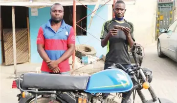  ?? Photo: Abubakar Sadiq Isah ?? Robbery suspects with the stolen motorcycle and pistol paraded at the FCT police command Abuja on Saturday