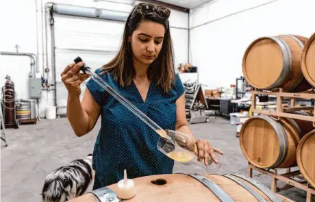  ?? Rachel Bujalski/Special to The Chronicle ?? Winemaker Priyanka French works in the warehouse of Signorello Estate in Napa. The U.S. is considerin­g labeling laws.