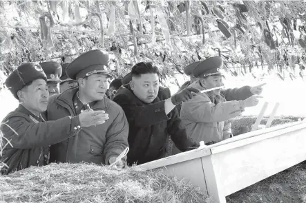  ?? Tribune News Service ?? n A photo released by KCNA news agency on March 12, 2013, shows North Korea leader Kim Jong Un visiting the Wolnae-do Defence Detachment on the western front line.