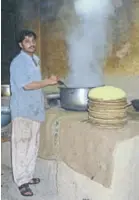  ??  ?? Roadside truck kitchen, India – chef looks as though he earns his wage.