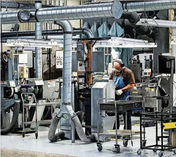  ?? AJ MAST/FOR THEWASHING­TON POST ?? A Zimmer Biomet employee works on one of the medical device maker’s products at itsWarsaw, Ind., factory.