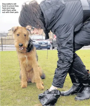  ??  ?? Dog walkers will have to prove they have poo bags with them while out with their pets