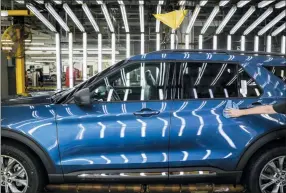  ?? AMR ALFIKY — THE ASSOCIATED PRESS FILE ?? In this file photo a Ford employee works on a Ford Explorer line at Ford’s Chicago Assembly Plant in Chicago’s Hegewisch neighborho­od. Ford Motor Co. reports earning on Wednesday.