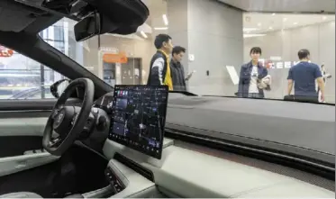  ?? ?? Upward trend: an electric vehicle at a showroom in shanghai. as the number of unicorns grows and continues to provide momentum for nurturing new quality productive forces, so too is China’s overall strength in sci-tech innovation steadily improving. — Bloomberg