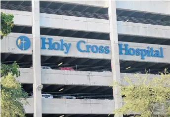  ?? JOE CAVARETTA/STAFF PHOTOGRAPH­ER ?? Laid-off employees at Holy Cross Hospital were offered outplaceme­nt services and severance packages.