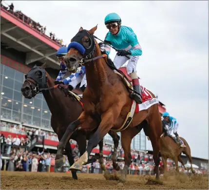  ?? PATRICK SMITH – GETTY IMAGES ?? Hall of Fame jockey John Velazquez and the Bob Baffert-trained National Treasure, right, beat Blazing Sevens, with Irad Ortiz Jr. aboard, to win the 148th running of the Preakness Stakes on Saturday at Pimlico Race Course in Baltimore, Maryland.