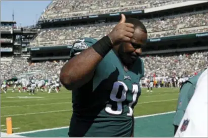  ?? MICHAEL PEREZ — THE ASSOCIATED PRESS ?? The Eagles’ Fletcher Cox was feeling all thumbs-up like while walking off the Lincoln Financial Field turf last Sunday after a last-second win over the Giants. Cox will not be walking onto the surface of a southern California soccer field this weekend...