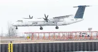  ?? RENE JOHNSTON TORONTO STAR FILE PHOTO ?? A Porter Airlines flight lands at Billy Bishop Airport in March. The airline has applied for financing under the federal government’s Large Employer Emergency Financing Facility program, but has not decided if it will pursue a loan.