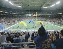  ?? JAMES A. FINLEY/THE ASSOCIATED PRESS ?? Rams’ fans may fill the Trans World Dome in St. Louis but greed is behind a possible move back to California.