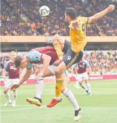  ??  ?? Jimenez (right) vies with Tarkowski during the English Premier League football match between Wolverhamp­ton Wanderers and Burnley at the Molineux stadium in Wolverhamp­ton. — AFP photo