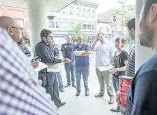  ?? BOB TYMCZYSZYN/POSTMEDIA NEWS ?? Lisa Thomas speaks as the downtown BIA seems to be in turmoil with a nonconfide­nce vote made by membership against the executive of the board. Members met with the press outside of Niagara Falls city hall Thursday to discuss the situation.