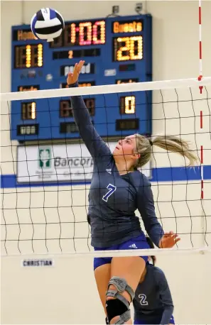  ?? Staff photo by Hunt Mercier ?? ■ Paul Pewitt’s Jo Osmon jumps up to tip the ball back against Columbia Christian School at the Spikers’ Classic on Thursday at Redwater High School in Redwater, Texas.