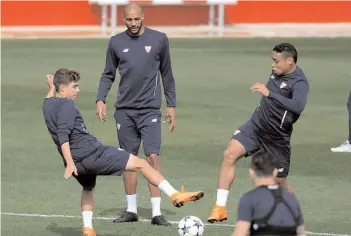  ?? — AFP ?? Sevilla players at a training session at Ciudad Deportiva in Sevilla on Monday, eve of their Champions League quarter- final first leg against Bayern Munich.