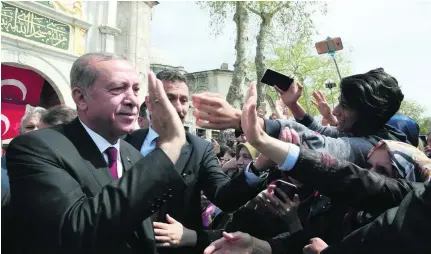  ?? Reuters ?? President Recep Tayyip Erdogan greets his supporters as he leaves Eyup Sultan mosque in Istanbul yesterday.