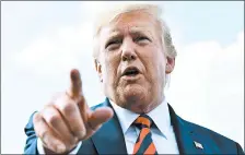  ?? NICHOLAS KAMM/GETTY-AFP ?? President Donald Trump speaks to the media Sunday before boarding Air Force One in Morristown, New Jersey.