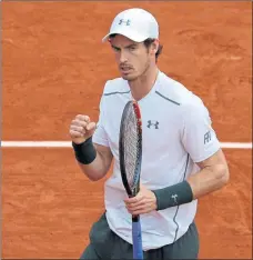  ?? Picture: PA ?? IN THE ZONE: Andy Murray kept his focus against John Isner despite a raininterr­upted match against the American.