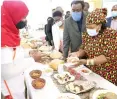  ??  ?? First Lady Auxillia Mnangagwa looks at traditiona­l dishes prepared by various women during Amai’s cookout traditiona­l meal cooking competitio­n in Bulawayo yesterday.— Pictures: John Manzongo