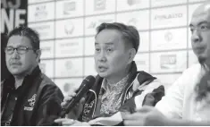  ??  ?? POC president Bambol Tolentino addresses a question as Phisgoc COO Tats Suzara, left, and SEA Games chef Bruce Lim await their turn in a media conference yesterday at the World Trade Center. (Ali Vicoy)