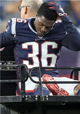  ?? Matt stoNe / herald staff file ?? IN OR OUT? Patriots special teamer Brandon King, seen above being carted off the field against the Panthers on Aug. 22, 2019, plans to follow the direction of coach Bill Belichick when OTAs begin next week.