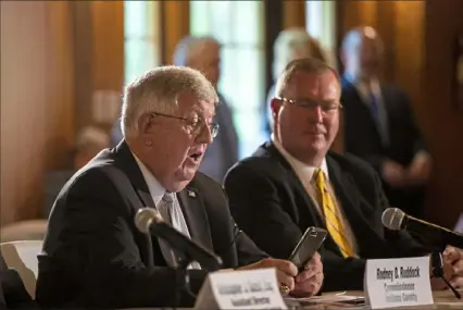  ?? Jessie Wardarski/ Post- Gazette ?? Indiana County Commission­er Rodney D. Ruddock, left, asks state legislator­s to help bring broadband coverage to digital deserts in rural Pennsylvan­ia.