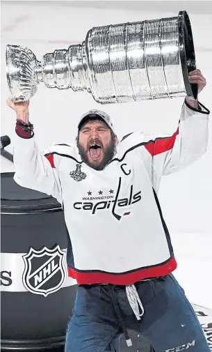  ?? ETHAN MILLER/GETTY IMAGES ?? Alex Ovechkin hoists the Stanley Cup for the first time after Thursday night’s win in Vegas, including his team-record and NHL-high 15th goal of a memorable post-season run.