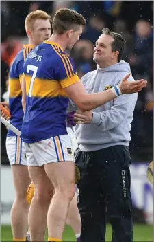  ??  ?? The Wexford manager congratula­tes Tipperary’s Pádraic Maher.