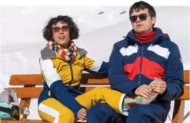  ?? Your Christmas Or Mine 2 ?? CAUGHT UP IN A CLASS DIVIDE: Cora Kirk and Asa Butterfiel­d enjoy the Austrian ski slopes in the festive comedy