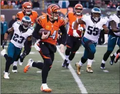  ??  ?? Cincinnati Bengals quarterbac­k Andy Dalton runs the ball against the Philadelph­ia Eagles.
