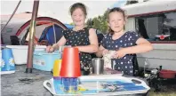  ?? PHOTO: GREGOR RICHARDSON ?? Dishes duty . . . Sisters Aisha (8, left) and Dakota (7) McKellar, of Dunedin, get the camp chores done at the Waitangi Recreation Reserve at Lake Aviemore over the New Year break.