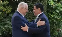  ?? (President’s Residence) ?? PRESIDENT REUVEN RIVLIN embraces his Paraguayan counterpar­t Horacio Cartes in Jerusalem yesterday.