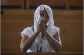  ?? INTI OCON — THE ASSOCIATED PRESS ?? A Catholic woman attends Sunday's mass at the Metropolit­an Cathedral in Managua, Nicaragua, on Sunday.