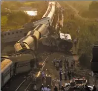  ?? The Associated Press ?? COLLISION: Two trains are seen after they collided Friday just outside Egypt’s Mediterran­ean port city of Alexandria killing at least dozens of people and injuring over 100 in the country’s deadliest rail accident in more than a decade.