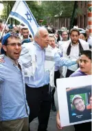  ?? (Lucas Jackson/Reuters) ?? RABBI AVI WEISS (center) demonstrat­es near the UN in New York in 2014, during a memorial service for the three kidnapped Israeli teenagers.