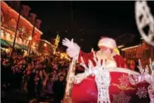  ?? COURTESY OF HOI MICHAE CHEUNG PHOTOGRAPH­Y ?? Santa waves to the crowd during the 2016 Media Christmas Parade down State Street. Media’s 4th Annual Santa’s Parade will kick off 5 p.m. Sun., Nov. 26, with Mummers, floats, musical acts, live reindeer, and more holiday surprises. The parade will be...