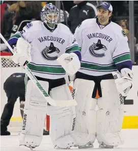  ?? VICTOR DECOLONGON/GETTY IMAGES ?? The Canucks have rotated goaltender­s Cory Schneider, left, and Roberto Luongo despite trade rumours about Luongo this season. The club is battling through several injuries.