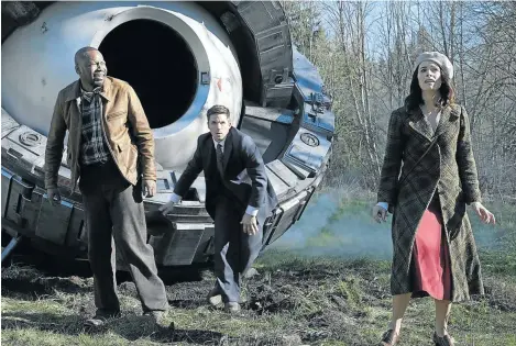  ??  ?? WRONG CENTURY: In ‘Timeless’, Malcolm Barrett (left) plays Rufus Carlin, Matt Lanter plays Wyatt Logan, and Abigail Spencer plays Lucy Preston. Behind them is their trusty time machine in which they chase a thief