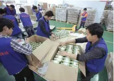  ?? — Reuters ?? Employees work at an Alibaba Group warehouse on the outskirts of Hangzhou, Zhejiang province, China.