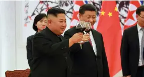  ?? (Reuters) ?? NORTH KOREAN leader Kim Jong Un and Chinese President Xi Jinping raise a toast in Beijing, China, in a photo released yesterday.