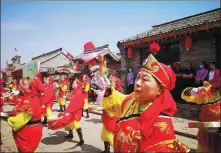  ?? ZHAO WENJUN / FOR CHINA DAILY ?? Residents in Songjiagou village in Kelang county perform drum dance to celebrate Spring Festival.