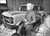  ?? CARLOS OSORIO AP ?? Kumar Galhotra, Ford President of the Americas and Internatio­nal markets group, next to the Bronco off-road SUV.