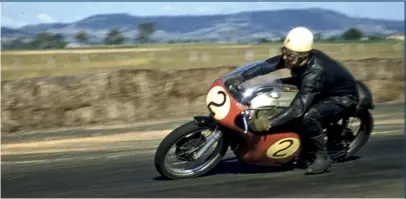  ??  ?? ABOVE Star of the 1960 meeting, Jack Ahearn trails a foot onto the main straight.