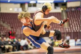  ?? NATE HECKENBERG­ER - FOR DIGITAL FIRST MEDIA ?? Exeter’s Ryan Watts throws Boyertown’s Matt Wilde in the first round of the PIAA Team Wrestling Championsh­ips on Feb. 9.