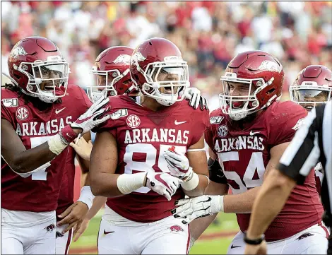  ?? NWA Democrat-Gazette/CHARLIE KAIJO ?? Arkansas tight end Cheyenne O’Grady (center) reacts Saturday after a touchdown against Colorado State during the fourth quarter at Donald W. Reynolds Razorback Stadium in Fayettevil­le.