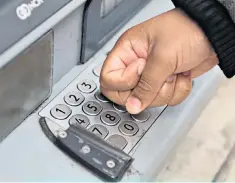  ??  ?? Businesses need cash, as does this customer using a cash machine without his fingertips