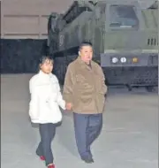  ?? AGENCIES ?? (Above) North Korean leader Kim Jong Un and his daughter observed a missile launch (right) at Pyongyang Internatio­nal Airport in Pyongyang, North Korea.