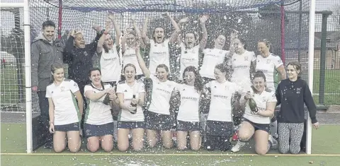  ?? ?? The champagne flows at Chichester Hockety Club ladies celebrate their league title | Picture: Pony Moore Photograph­y