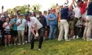  ?? Photograph: Seth Wenig/AP ?? Michael Block hits from the rough on the 18th during the final round at Oak Hill as a crowd of spectators watch, and film, on.