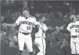  ?? ROB SCHUMACHER/THE REPUBLIC ?? Diamondbac­ks reliever Yoan Lopez (50) earns his first career save against the Orioles in a 5-2 win on Wednesday afternoon at Chase Field in Phoenix.